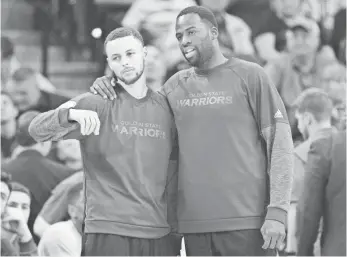  ?? SOOBUM IM, USA TODAY SPORTS ?? Stephen Curry, left, and Draymond Green didn’t play against the Spurs on March 11.