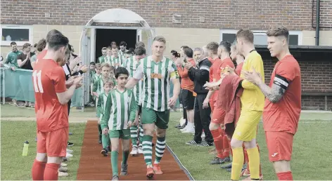  ?? PICTURE BY KTE SHEMILT KS190217-2 ?? Chichester City get a guard of honour from Pagham on the day they picked up the SCFL league trophy