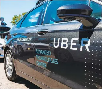  ?? Angelo Merendino AFP/Getty Images ?? A KEY internal recommenda­tion in Uber’s disclosure­s cites the need for “improving the overall software system design,” akin to saying Uber’s robot car needed a better brain with sharper thinking.