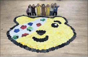  ??  ?? Children at Woodcroft First School in Leek have taken part in a huge sponsored spot attack challenge to make an enormous Pudsey Bear face collage for Children in Need. Pupils spent the morning making different coloured spots out of different materials, including tissue paper, feathers and some old school uniform. Parents sponsored their children to complete the Spot Attack and so far the school has raised £156.07.