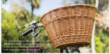  ?? ?? The Pashley Princess Sovereign’s large handwoven wicker basket makes it the perfect farmer’s market produce carrier, with room for a bottle of wine as well.