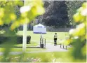  ??  ?? Forensic investigat­ion A police forensic team was at Strathaven Park following the death