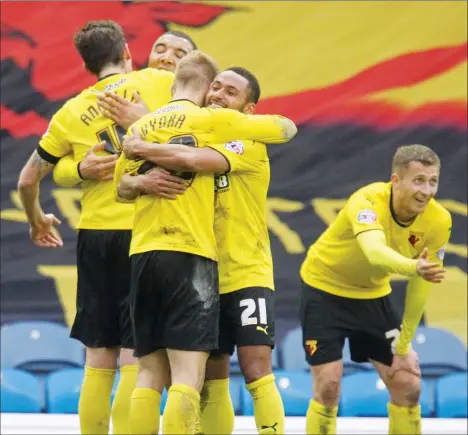  ?? PICTURES: Action Images ?? MAT FINISH: Watford’s Matej Vydra celebrates scoring their crucial third goal with teammates