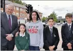  ??  ?? n TOUGH TIMES AHEAD: Left, Cheryl Chapman in her shop, on West End Road, Ruislip and above, staff and pupils from Sacred Heart Catholic Primary School with HS2 campaigner Lottie Jones