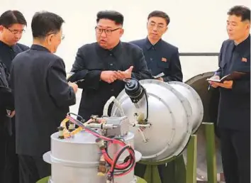  ?? AP ?? North Korean leader Kim Jong-un at an undisclose­d location inspects the loading of a hydrogen bomb into a new interconti­nental ballistic missile. Independen­t journalist­s were not given access to cover the event.