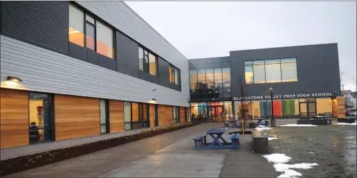  ?? Photo by Ernest A. Brown ?? A ribbon-cutting ceremony is held at the recently-opened Blackstone Valley Prep High School in Cumberland Tuesday. Constructi­on for the $15 million project began last year and opened to students on Nov. 27. The building is designed to feel like a...