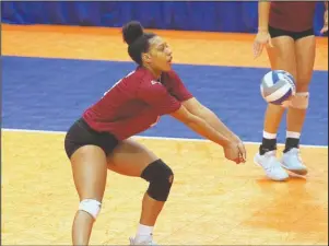  ?? The Sentinel-Record/Richard Rasmussen ?? FIRST IMPRESSION: Henderson State junior Courtney Bolf, a unanimous selection to the All-Great American Conference First Team, performs a dig Thursday during a straight-set victory against Oklahoma Baptist in the quarterfin­als of the 2018 GAC Volleyball Championsh­ips tournament at Bank OZK Arena.
