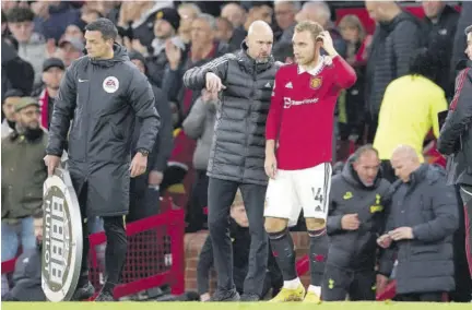  ?? (Photo: AP) ?? Manchester United’s Christian Eriksen (right) talks with head coach Erik ten Hag (centre) as he prepares to go onto the field during a Premier League match against Tottenham Hotspur at Old Trafford in Manchester, England on Wednesday, October 19, 2022.