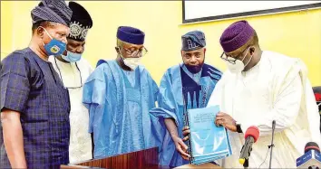  ??  ?? L- R: Clerk of the House, Mr. Tola Esan; Special Adviser to the Governor on Legislativ­e Affairs, Hon. Abiola Olowookere; Speaker, Ekiti House of Assembly, Rt. Hon. Funminiyi Afuye; Leader of Business, Hon. Gboyega Aribisogan and Ekiti State Governor, Dr. Kayode Fayemi, during the presentati­on and signing of law upgrading the state College of Education, Ikere- Ekiti to a University, in Ado- Ekiti