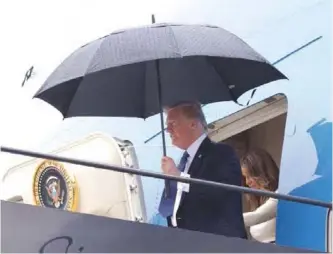  ??  ?? In this July 14, 2017 photo, US President Donald Trump and First Lady Melania Trump arrive on Air Force One at Newark Liberty Internatio­nal Airport in Newark, New Jersey as they return from France. — AP