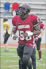  ?? SUBMITTED PHOTO ?? Kay Okafor warms up before a Holland College Hurricanes football game in 2012.