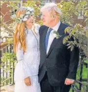  ?? AP ?? Boris Johnson and Carrie Johnson pose for a photo in a garden after a low-key wedding on Saturday.