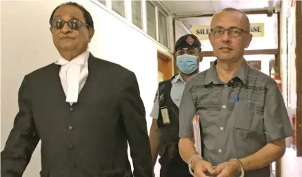  ?? Photo: Ashna Kumar ?? Nausori Highlands murder accused Muhammad Isoof, right, with his lawyer Iqbal Khan outside the High Court in Lautoka on January 4, 2022.