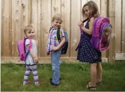  ?? MARTA IWANEK/TORONTO STAR ?? Sarah, Josh and Emily Steinfeld are ready to hit the books with home-made lunches. Unbranded food items help keep costs down when heading back to school.