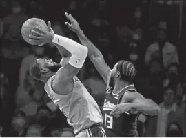  ?? Ringo H.W. Chiu Associated Press ?? THE LAKERS’ LeBron James shoots against Sacramento’s Tristan Thompson during the second half of a game Friday. The Kings won 141-137 in triple overtime.