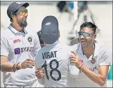  ?? PTI ?? Axar Patel celebrates a wicket with captain Virat Kohli and Ishant Sharma on Day 4 of the second Test on Tuesday.
