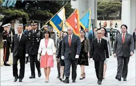  ?? AHN YOUNG-JOON/AP ?? Vice President Mike Pence, center, and wife Karen visit a cemetery in Seoul on Sunday.