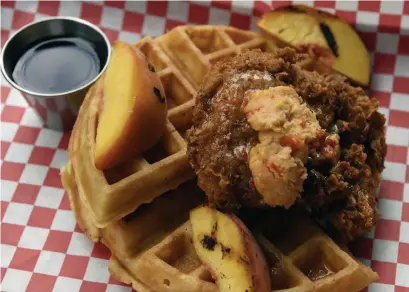  ?? Photos by Rachel Ellis, The Denver Post ?? Chicken and waffles at The Coop Chicken + Beer at the Wynkoop Brewery.