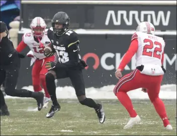  ?? CLIFF GRASSMICK/STAFF PHOTOGRAPH­ER ?? The Buffaloes’ Maurice Bell returns a kickoff against the Utah Utes at Folsom Field in Boulder on Dec. 12, 2020.