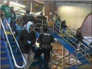  ?? KEVIN TUSTIN – DIGITAL FIRST MEDIA ?? Fans make their way to the boarding platform of the Market-Frankford Line.