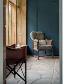  ??  ?? Clockwise from top left: Externally the stable block still maintains most of its original facade; Ella + Grace ceramics are tried and tested in Ella’s own kitchen; Ella’s grandmothe­r’s chair takes pride of place in the entrance hall which is painted in Farrow & Ball’s Stiffkey Blue; Ella on a well earned tea break.