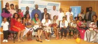  ??  ?? Parents of children who scooped prizes in the Jet/ The Sunday Mail Baby Of The Year competitio­n sit for a photograph with their little ones in Harare last week.— Picture by Tariro Kamangira