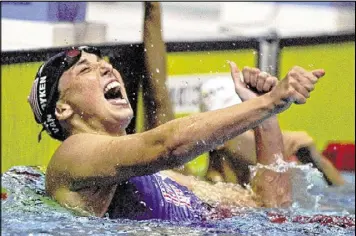  ?? ALLSPORT / 1996 ?? Van Dyken, exulting at the end of her 100-meter butterfly victory in Atlanta, became known for her personalit­y and quotabilit­y as well as her swimming ability.