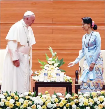  ?? AUNG HTET/AFP ?? Pope Francis sits next to Myanmar’s civilian leader Aung San Suu Kyi during an event in Naypyidaw yesterday. Pope Francis called for respect for rights and justice in a keenly-watched address yesterday, but refrained from any mention of the Rohingya,...