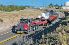  ?? COURTESY LOS ALAMOS NATIONAL LABORATORY ?? Two trucks will begin pulling — and pushing — the 460,000-pound copper and steel motor-generator rotor on a trailer at speeds between 25 and 40 mph from Los Alamos at around 9 a.m. Friday.