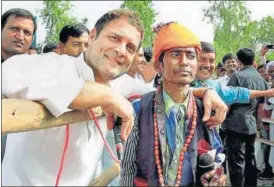  ?? PTI ?? ▪ Congress vice president Rahul Gandhi interacts with a snake charmer at a meeting during his road show in Patan district on Monday.