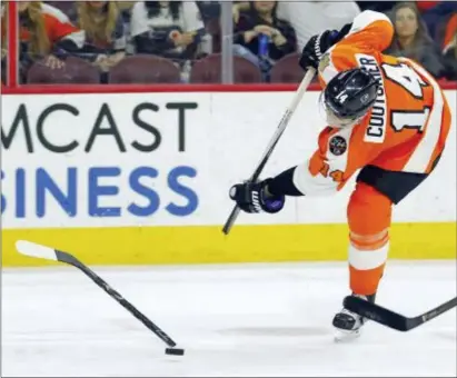  ?? THE ASSOCIATED PRESS FILE ?? The Flyers’ Sean Couturier got turned and twisted the wrong way in a collision with rock-hard defenseman Radko Gudas Tuesday during a practice at the Skate Zone. Couturier’s status is unknown with Game 4 of a first-round series with the Penguins looming.