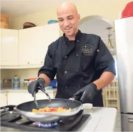  ??  ?? Healthy Chef Paul Martin Williams is cooking up something great. Below: Yum! This sweet potato crusted fish fillet tastes as good as it looks.