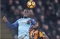  ?? ANNY LAWSON / AP ?? Manchester City’s Bacary Sagna beats Hull City's Dieumerci Mbokani to a header during their English Premier League match at KCOM Stadium, Hull, on Monday.