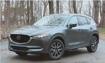  ?? STAFF PHOTO BY MATT WEST ?? LIGHT SHOW: The 2018 Mazda CX-5 is equipped with LED headlights, taillights, fog lights and daytime running lights.