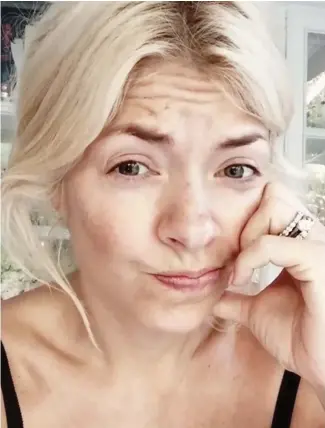  ??  ?? Bare-faced: The mother of three wears no make-up in the candid clip