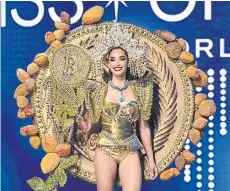  ?? REUTERS ?? Alejandra Guajardo, Miss Universe El Salvador 2022, poses in an outfit inspired by the country’s use of Bitcoin.