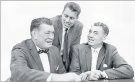  ?? THE ASSOCIATED PRESS ?? Boxing heavyweigh­ts Gene Tunney, left, and Jack Dempsey, right, pose with Tunney’s son, John V. Tunney, at a news conference in Los Angeles.