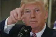  ?? PABLO MARTINEZ MONSIVAIS — THE ASSOCIATED PRESS ?? President Donald Trump points to members of the media as he answers questions in the lobby of Trump Tower in New York.