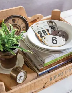  ?? ?? A simple vignette of vintage numbered tags, door plaques and clock memorabili­a adds up to more than the sum of its parts. Use a stack of hardbound coffee table books as a riser to ensure your special collection­s are seen.