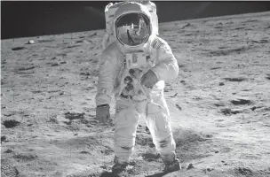  ?? NEIL ARMSTRONG/NASA VIA ASSOCIATED PRESS ?? Astronaut Buzz Aldrin, lunar module pilot, walks on the surface of the moon during the Apollo 11 extravehic­ular activity on July 20, 1969.