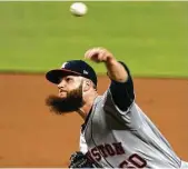  ?? Wilfredo Lee / Associated Press ?? Dallas Keuchel’s beard gets into the flow of a short but smooth outing. The lefthander went five innings to cruise to victory on a night the Astros had 12 runs on 14 hits.