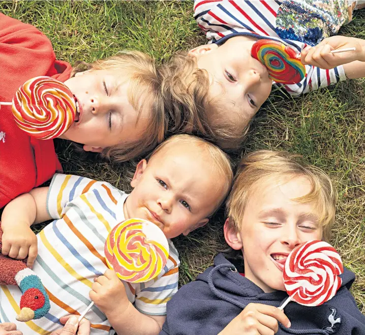  ?? ?? Clockwise, from top: Horatio (6), Hector (9), Edgar (1) and Alfred (8) enjoy their lollies, but their mother knows it’s time to tackle the sticky subject of sugar