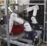  ??  ?? Robots placing the finished twist drills into plastic sleeves