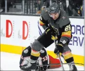  ?? Caroline Brehman Las Vegas Review-journal ?? Knights forward William Carrier (28) darts out from behind the Columbus net in the third period after retrieving the puck and upending a Blue Jackets player.