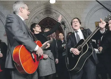  ?? SEAN KILPATRICK/THE CANADIAN PRESS FILES ?? From left, NDP MPs Charlie Angus, Megan Leslie and Andrew Cash are joined by fellow NDP MPs performing a Stompin’ Tom song in the foyer of the House of Commons in 2013.