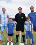  ??  ?? Leading teams out Blairgowri­e’s mascots on Saturday were brothers Reece and Josh Robertson