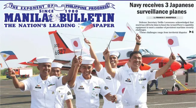  ?? (Czar Dancel) ?? JAPAN-DONATED PLANES – Philippine Navy sailors wave Philippine and Japanese flags in front of a Beechcraft TC90 trainer plane that landed at the Navy airstrip in Sangley Point, Cavite City, Monday. Three TC90s, which were donated by Japan, arrived at...