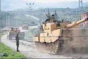  ?? REUTERS ?? A Turkish military convoy at a village on the TurkishSyr­ian border in Kilis province, Turkey, on Sunday.