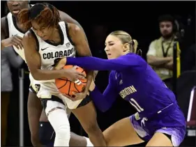  ?? CLIFF GRASSMICK — STAFF PHOTOGRAPH­ER ?? Colorado’s Jaylyn Sherrod rips the ball Washington Huskies’ Haley Van Dyke in Boulder on Sunday.