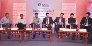  ?? PHOTO: SANJAY K SHARMA ?? (From left) Navin Kumar, former chairman, GSTN; Prakash Kumar, CEO, GSTN; Manish Kumar Sinha, commission­er, CBEC; Pratik Jain, head-indirect tax, PwC; Rajdeep Dattagupta, CFO, Pepsico; Gagan Rai, MD & CEO, NSDL e-governance; and Nishant Shah, partner...